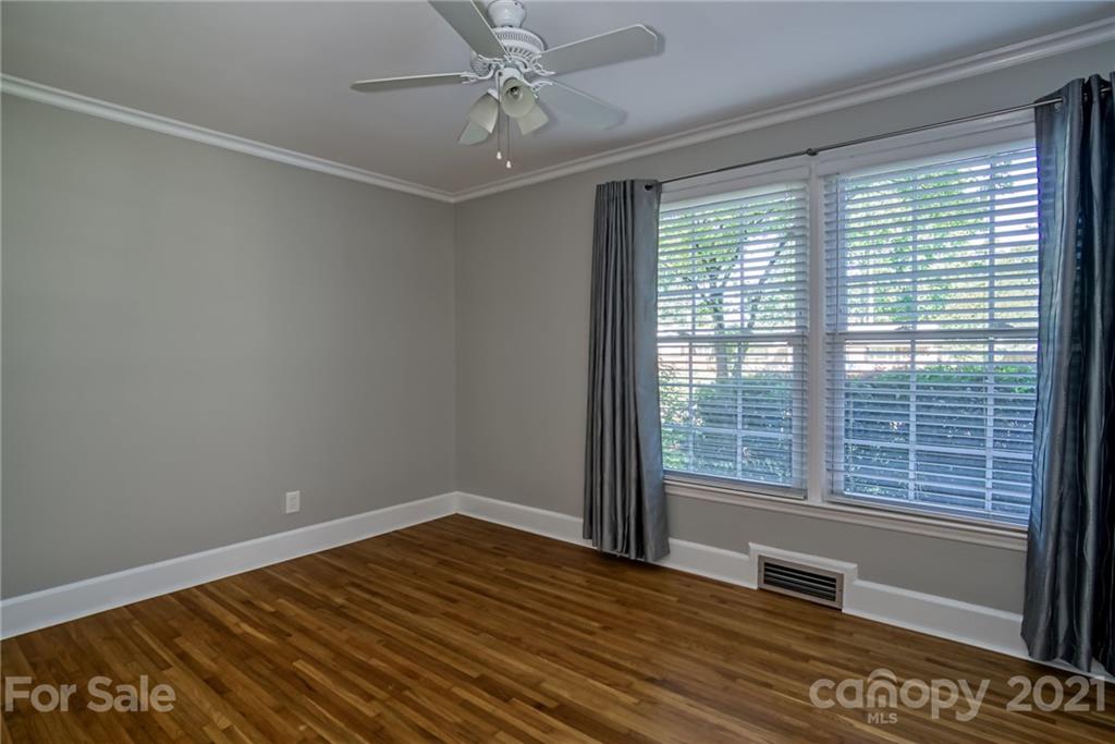 5401 Valley Forge Road Charlotte, NC 28210 - Photo 14 of 27 a view of an empty room with wooden floor and a window