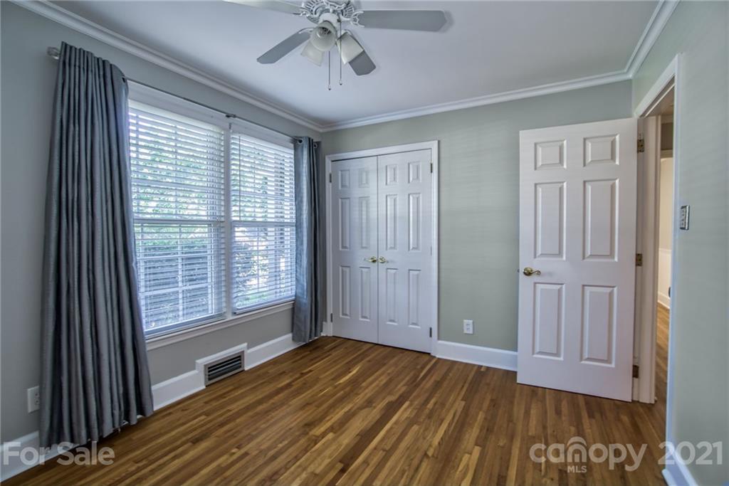 5401 Valley Forge Road Charlotte, NC 28210 - Photo 15 of 27 a view of empty room with wooden floor and fan