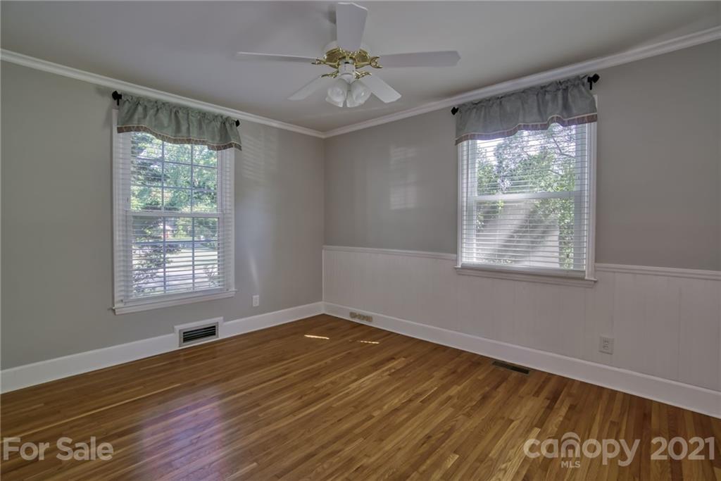 5401 Valley Forge Road Charlotte, NC 28210 - Photo 16 of 27 a view of an empty room with wooden floor and a window