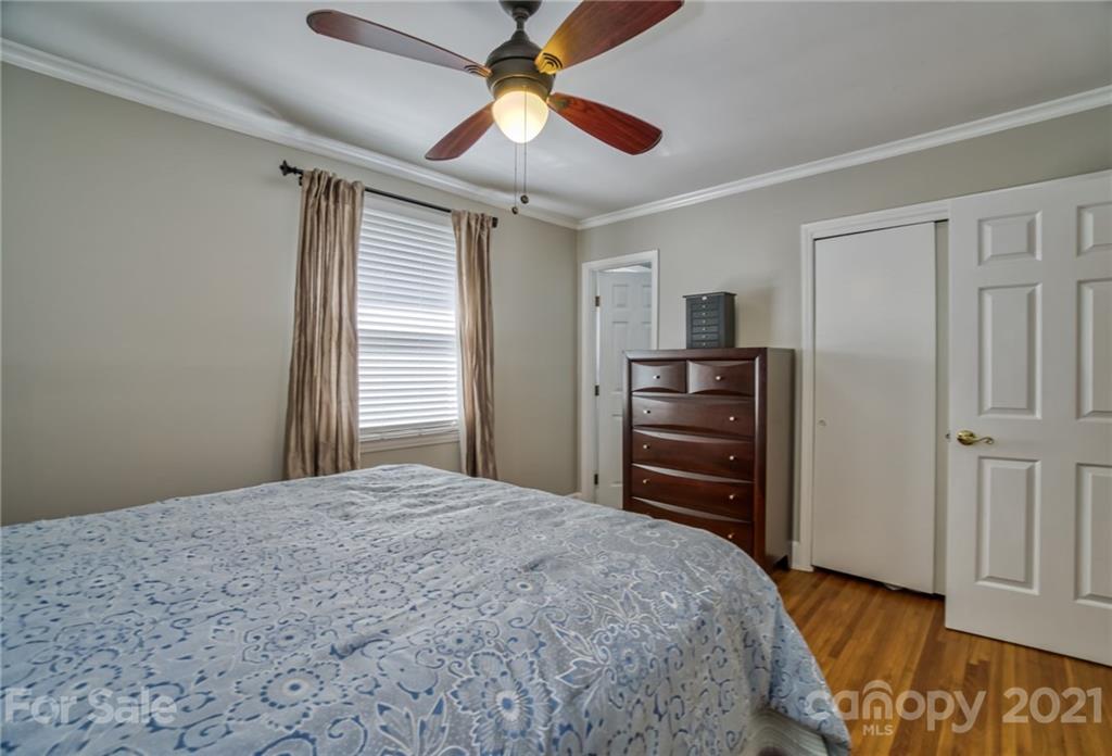 5401 Valley Forge Road Charlotte, NC 28210 - Photo 19 of 27 a bedroom with a bed and a television