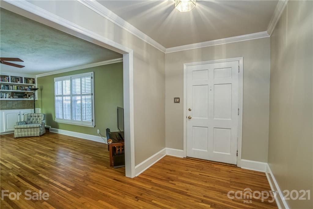 5401 Valley Forge Road Charlotte, NC 28210 - Photo 3 of 27 a view of an empty room with wooden floor and a window