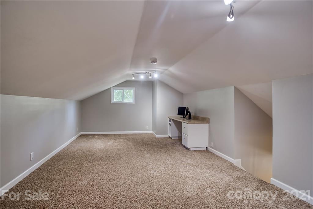 5401 Valley Forge Road Charlotte, NC 28210 - Photo 22 of 27 an empty room with windows and ceiling fan