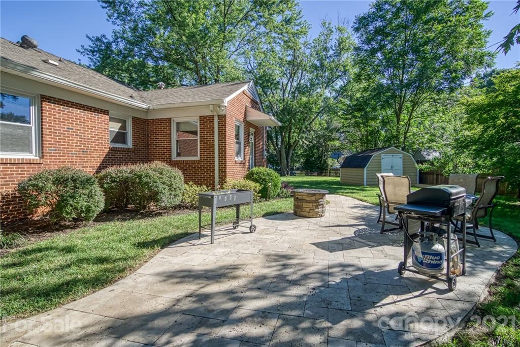 5401 Valley Forge Road Charlotte, NC 28210 - Photo 24 of 27 a view of a house with backyard sitting area and garden