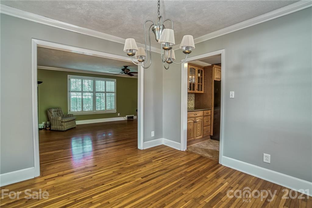 5401 Valley Forge Road Charlotte, NC 28210 - Photo 7 of 27 a view of an empty room with wooden floor and a window
