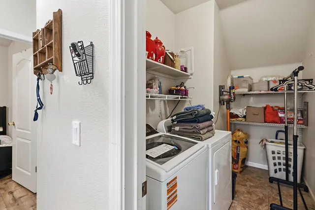 a kitchen with a refrigerator and a stove