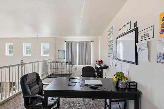 a view of a workspace with furniture
