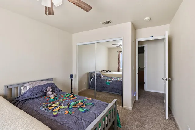 a view of a hallway that has a couch and a stove in it