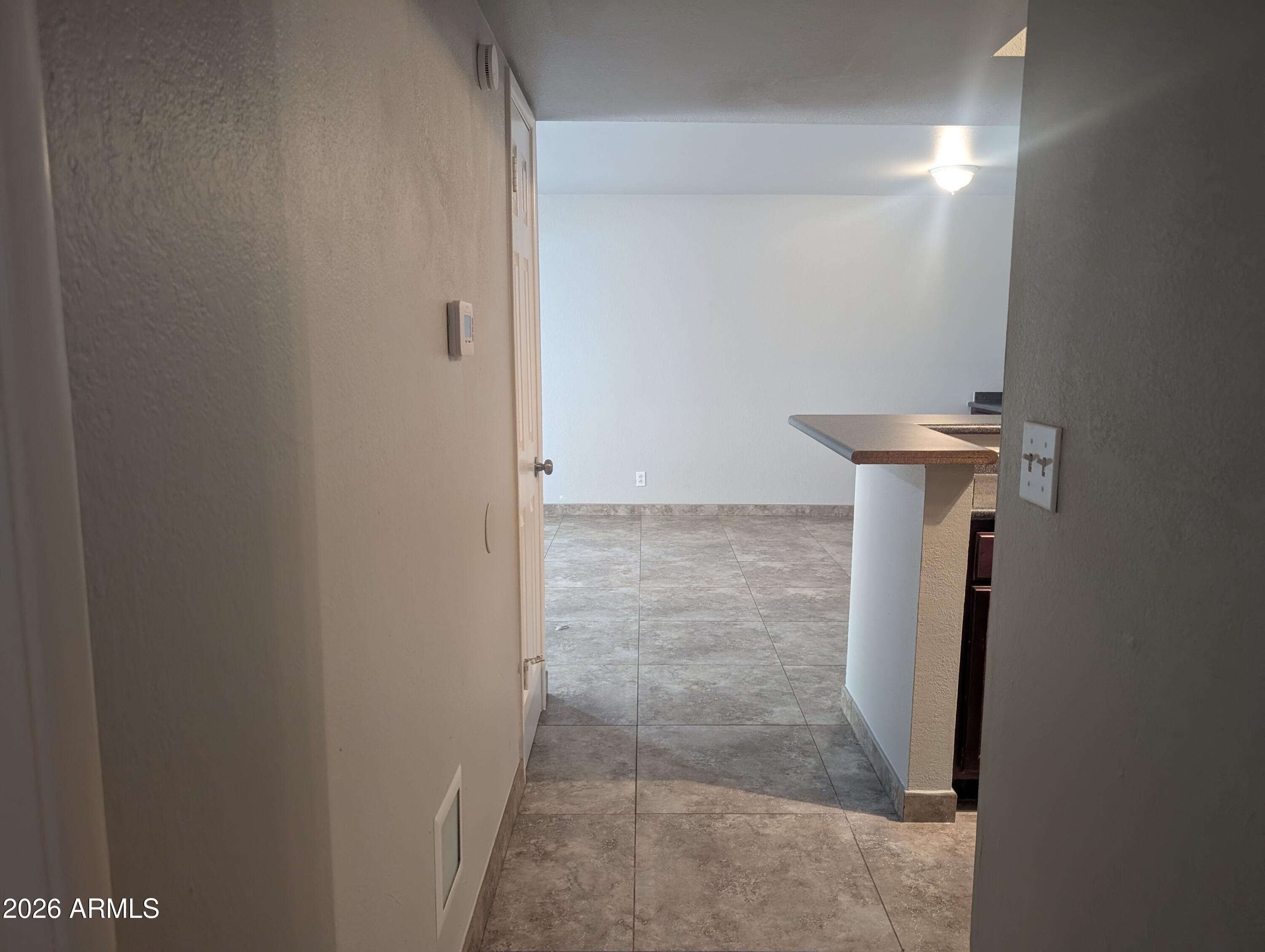540 North May, Unit 1101 Mesa, AZ 85201 - Photo 8 of 15 Hallway to laundry and bedrooms