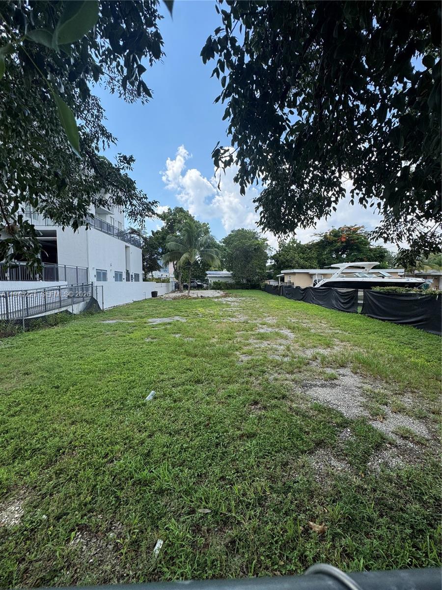 2720 Southwest 17th Street Miami, FL 33145 - Photo 2 of 5 a backyard of a house with lots of green space and fountain