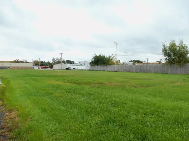 a view of a green field with clear sky