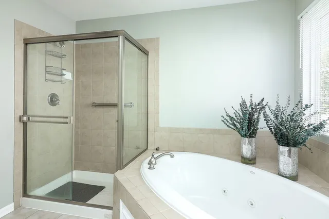 a white bath tub sitting next to a white tub