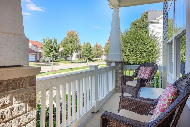 a view of balcony with furniture