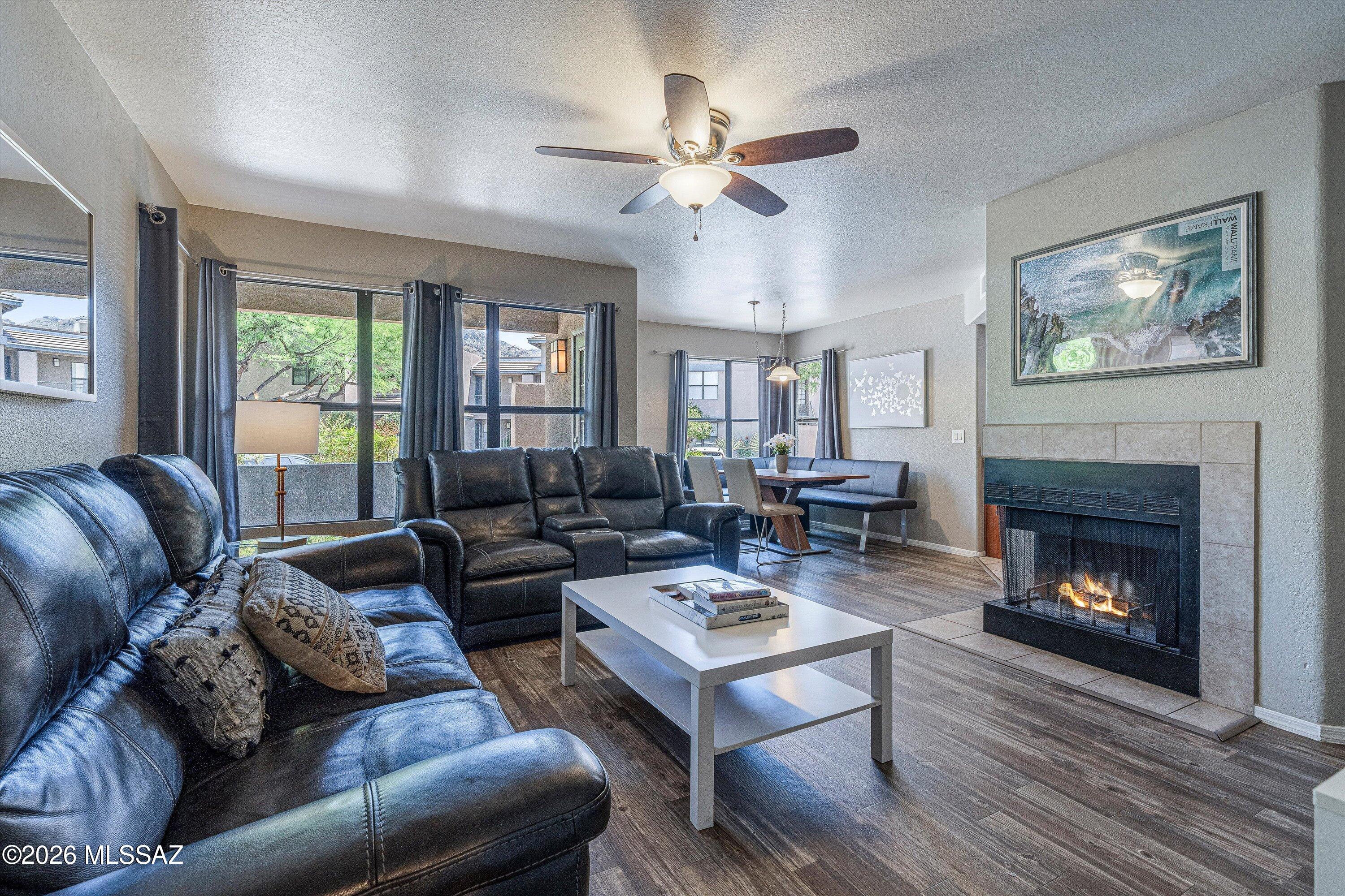 5855 North Kolb Road, Unit 8106 Tucson, AZ 85750 - Photo 5 of 34 a living room with furniture fireplace and window