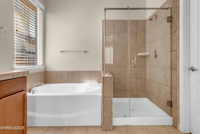 a bathroom with a shower and a bathtub