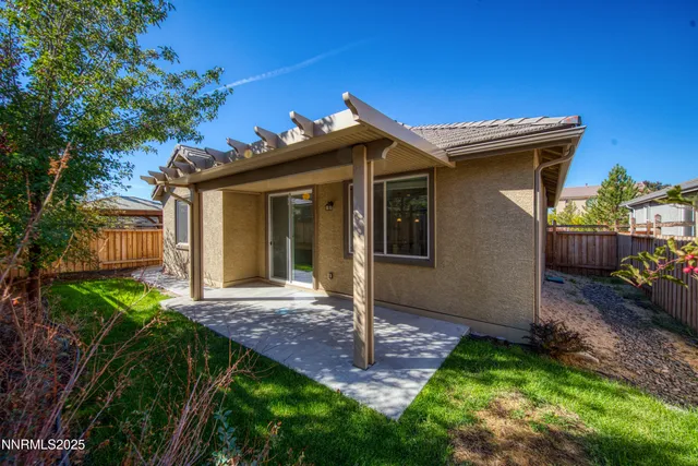 a view of a house with a small yard and plants