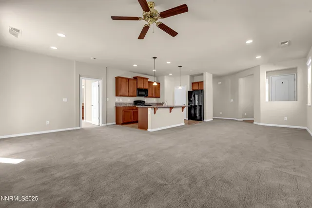 a view of a kitchen with a sink and a window
