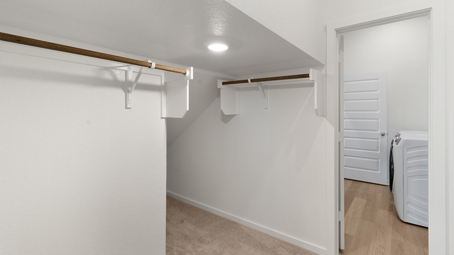 25812 Jasmine Sprig Lane Elgin, TX 78621 - Photo 16 of 33 Functional closet space provides ample storage, complemented by a convenient laundry area nearby.