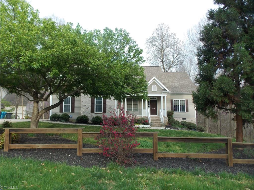 7802 Perthshire Drive Oak Ridge, NC 27310 - Photo 2 of 30 Covered front porch to enjoy the peaceful surroundings