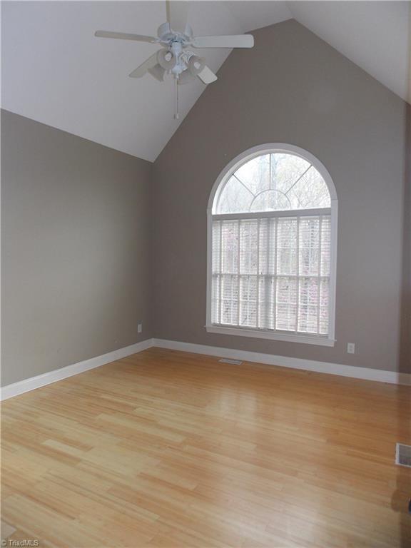 7802 Perthshire Drive Oak Ridge, NC 27310 - Photo 12 of 30 Master Bedroom with hardwood floors and vaulted ceilings