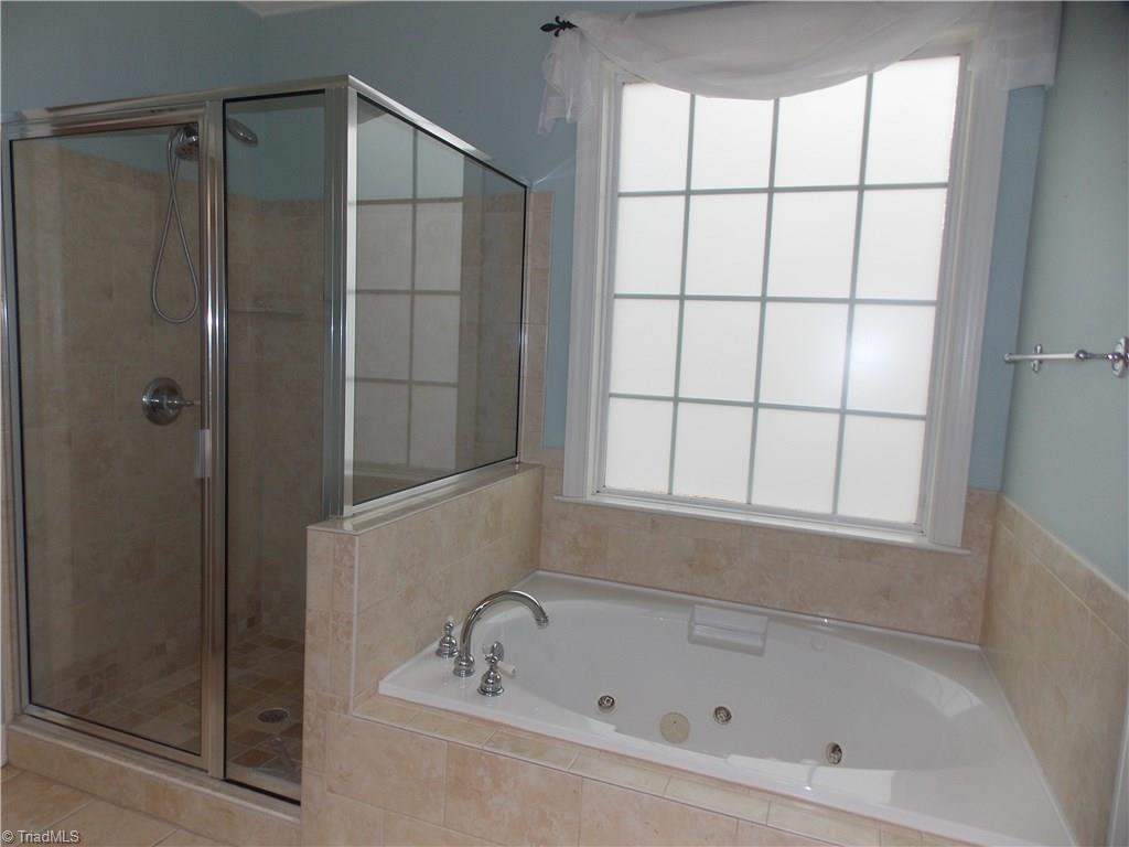 7802 Perthshire Drive Oak Ridge, NC 27310 - Photo 15 of 30 Master en suite with separate shower and jetted tub