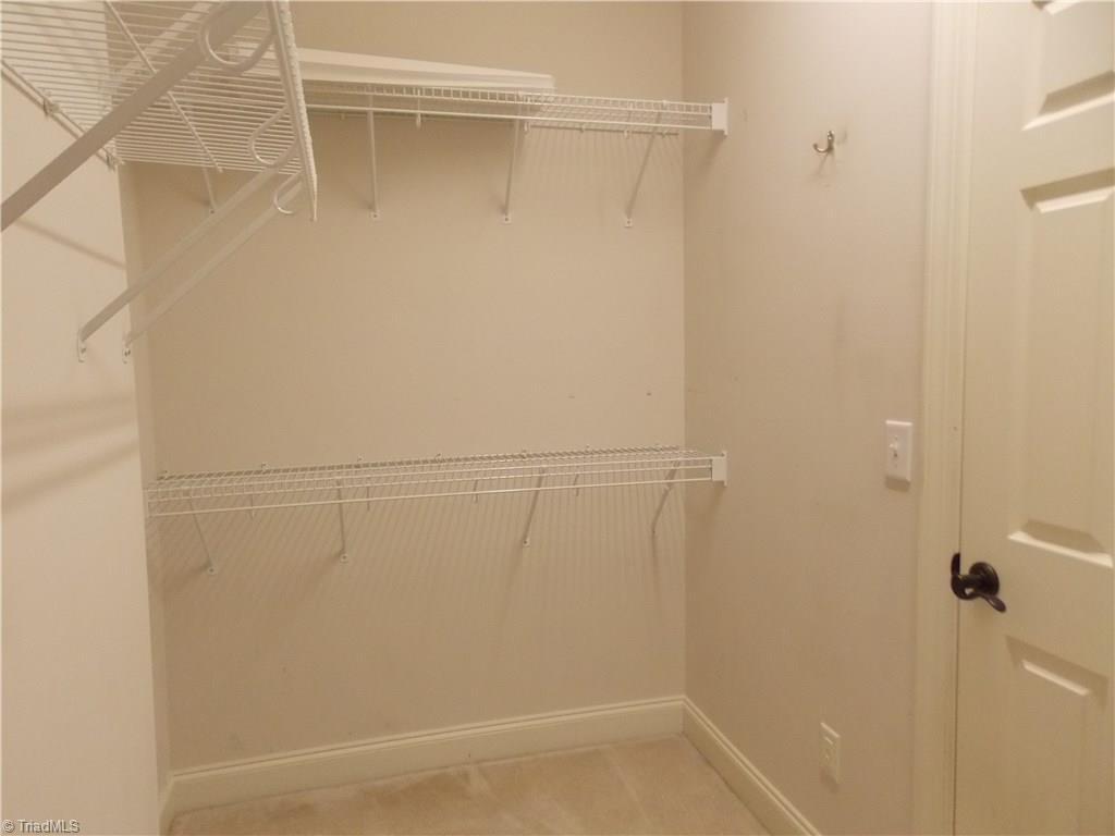 7802 Perthshire Drive Oak Ridge, NC 27310 - Photo 16 of 30 Master walk-in closet with plenty of space/storage