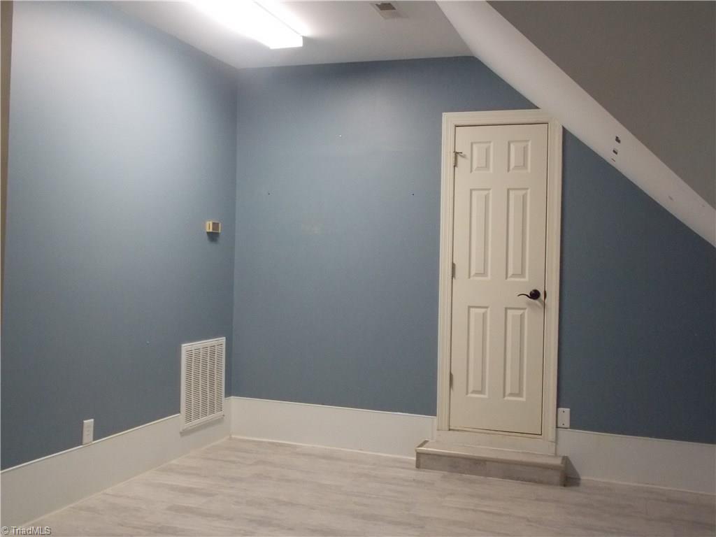 7802 Perthshire Drive Oak Ridge, NC 27310 - Photo 23 of 30 Bonus room with entrance to walk-in attic