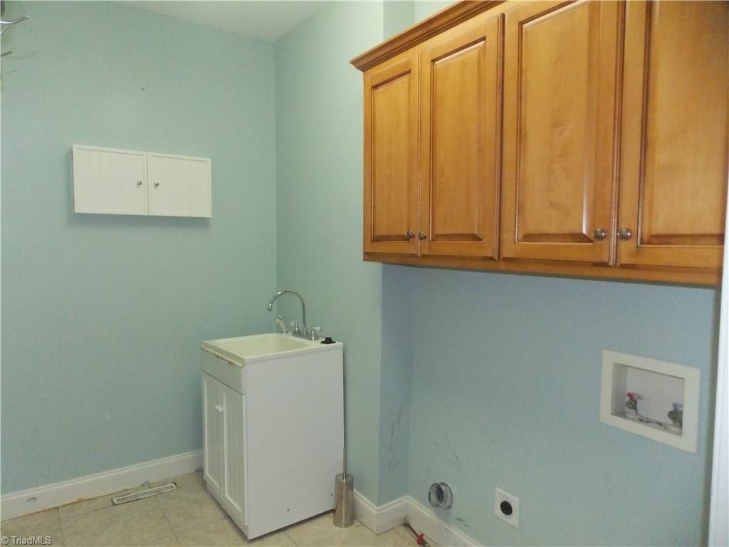 7802 Perthshire Drive Oak Ridge, NC 27310 - Photo 27 of 30 Laundry room with sink