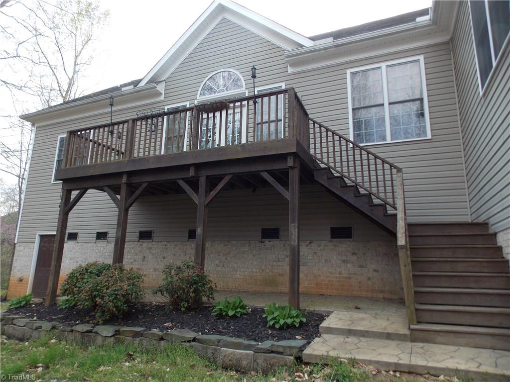7802 Perthshire Drive Oak Ridge, NC 27310 - Photo 4 of 30 Back deck and walk-in crawl space