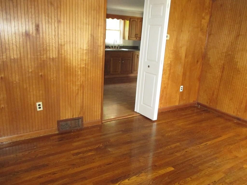 14 Krepps Road Ambridge, PA 15003 - Photo 3 of 22 an empty room with wooden floor and windows