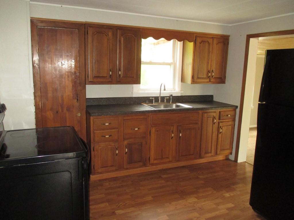 14 Krepps Road Ambridge, PA 15003 - Photo 7 of 22 a kitchen with granite countertop a refrigerator and a sink
