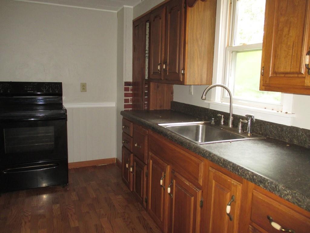 14 Krepps Road Ambridge, PA 15003 - Photo 9 of 22 a kitchen with granite countertop a refrigerator and a sink