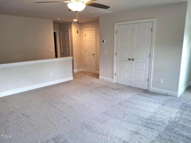 an empty room with a bathroom