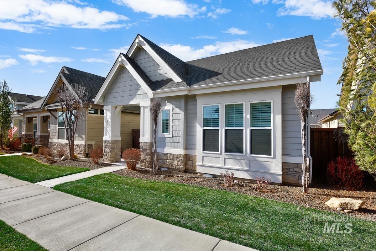 410 West Lockhart Lane Meridian, ID 83646 - Photo 2 of 41 Craftsman inspired home featuring stone siding and roof with shingles