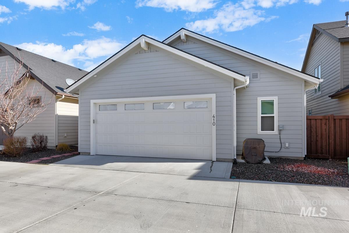410 West Lockhart Lane Meridian, ID 83646 - Photo 26 of 41 Single story home featuring concrete driveway and an attached garage
