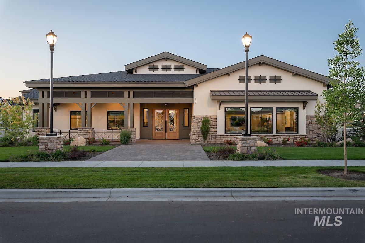 410 West Lockhart Lane Meridian, ID 83646 - Photo 33 of 41 View of front facade with stucco siding, covered porch, stone siding, and french doors