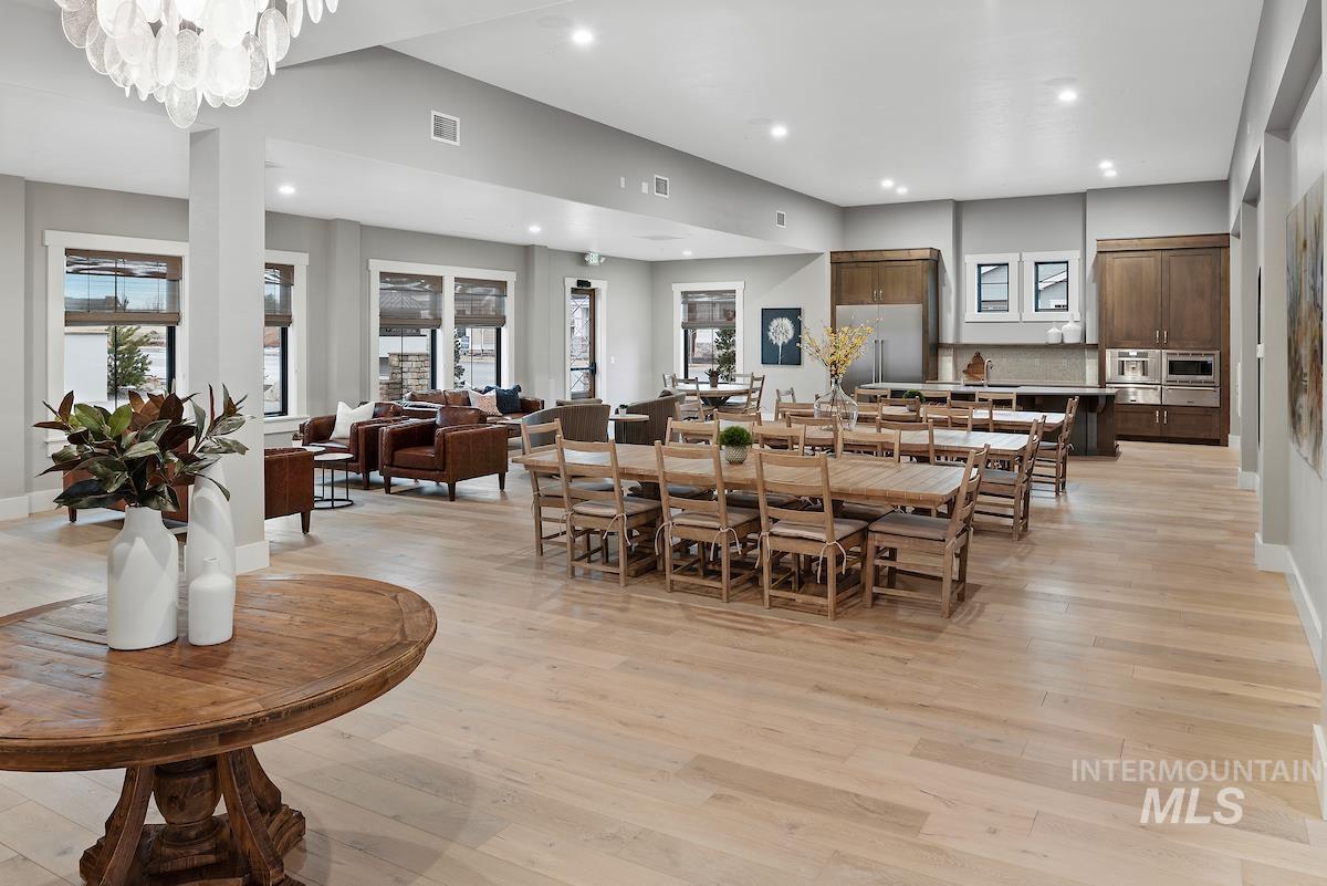 410 West Lockhart Lane Meridian, ID 83646 - Photo 36 of 41 Dining room featuring light wood-style flooring and a chandelier