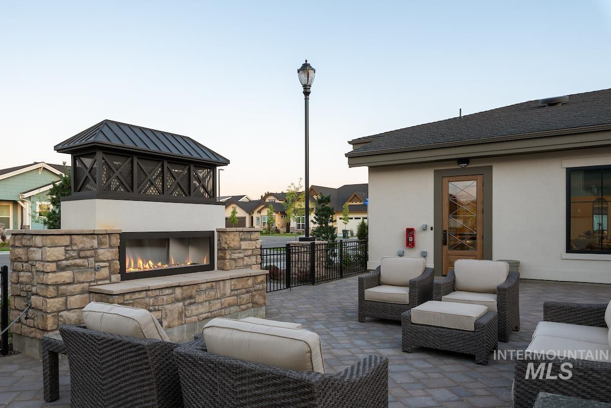 410 West Lockhart Lane Meridian, ID 83646 - Photo 37 of 41 View of patio with an outdoor living space with a fireplace