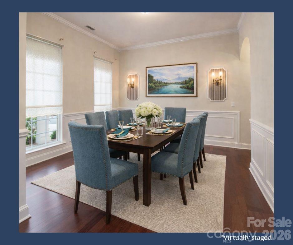 878 Treasure Court Fort Mill, SC 29708 - Photo 2 of 48 a view of a dining room with furniture and wooden floor