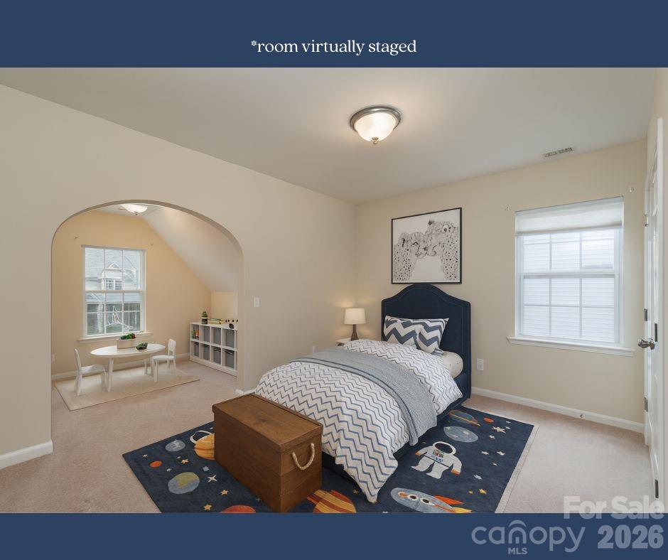 878 Treasure Court Fort Mill, SC 29708 - Photo 23 of 48 a bedroom with a bed and window