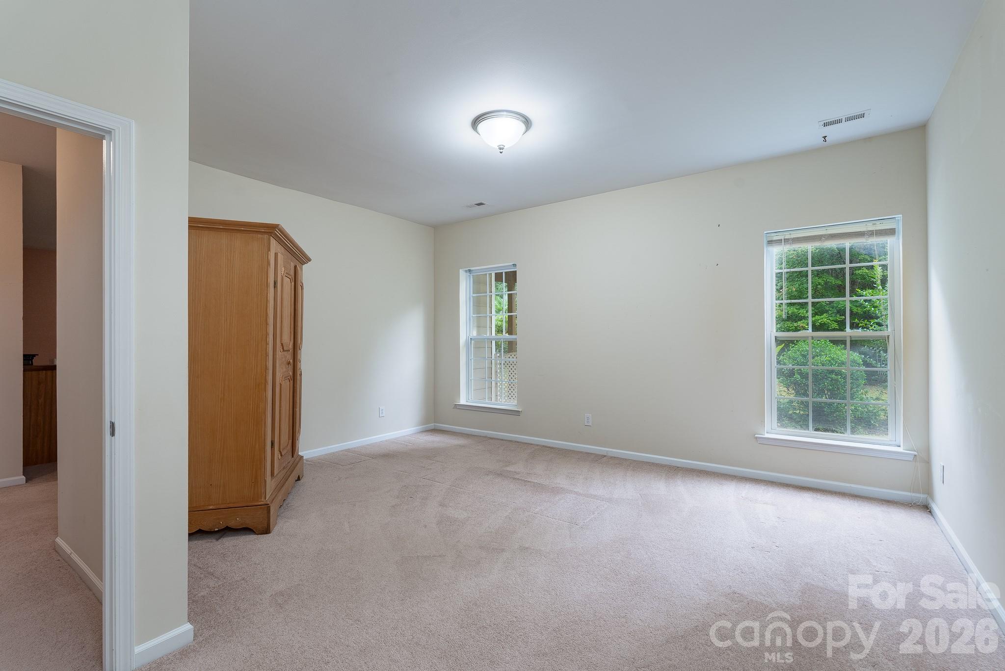 878 Treasure Court Fort Mill, SC 29708 - Photo 32 of 48 an empty room with windows and closet