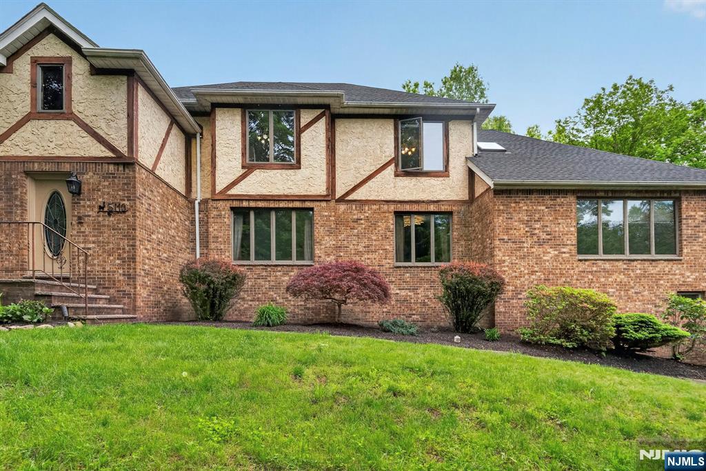 5110 Berkshire Valley Road Oak Ridge, NJ 07438 - Photo 47 of 49 a front view of a house with garden