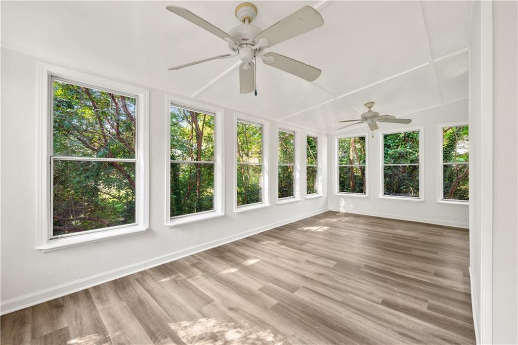 819 Gardenia Lane Decatur, GA 30033 - Photo 17 of 41 a view of an empty room with wooden floor and a window