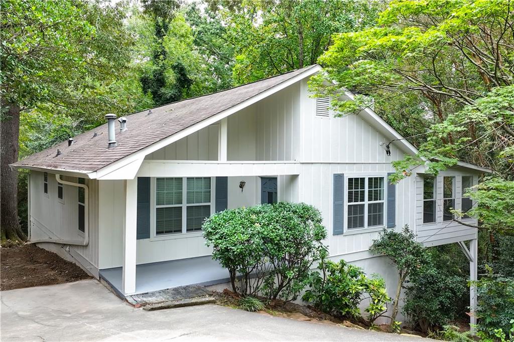 819 Gardenia Lane Decatur, GA 30033 - Photo 2 of 41 a view of a house with a yard plants and large tree