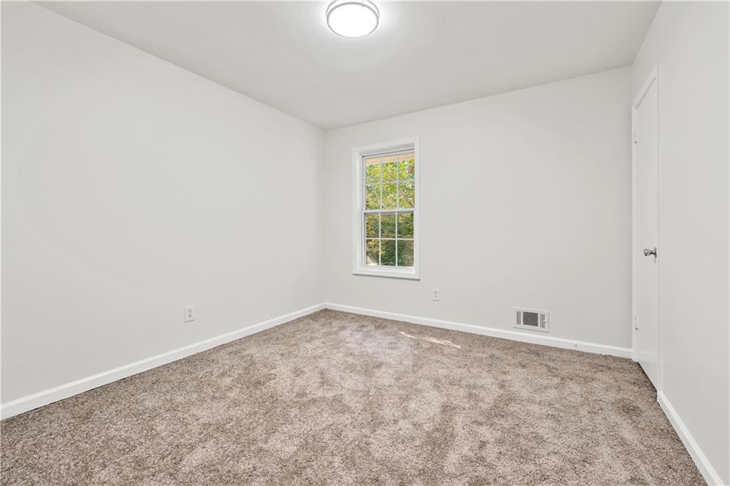 819 Gardenia Lane Decatur, GA 30033 - Photo 26 of 41 an empty room with windows