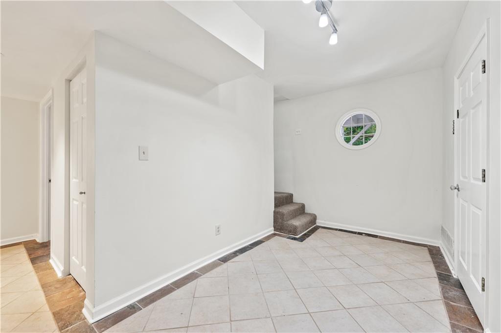 819 Gardenia Lane Decatur, GA 30033 - Photo 30 of 41 a view of a room with an empty space and a window