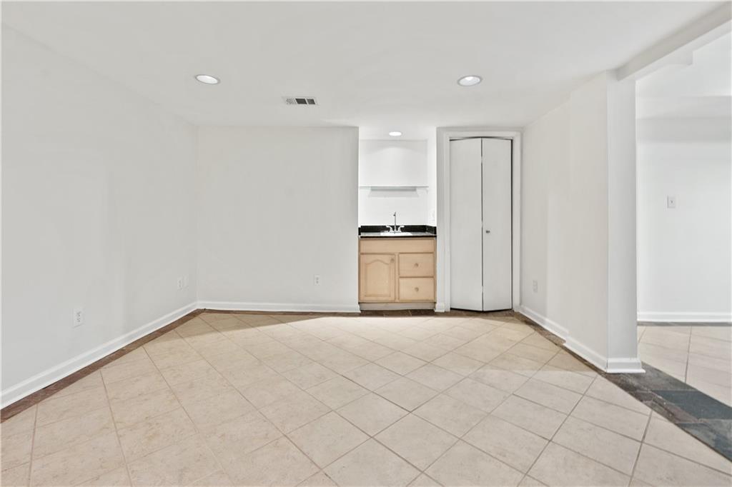 819 Gardenia Lane Decatur, GA 30033 - Photo 32 of 41 a view of a kitchen with granite countertop cabinets and utility room