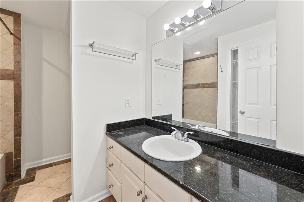 819 Gardenia Lane Decatur, GA 30033 - Photo 34 of 41 a bathroom with a sink and a mirror
