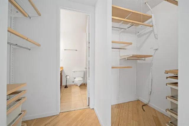 a view of a room with wooden floor