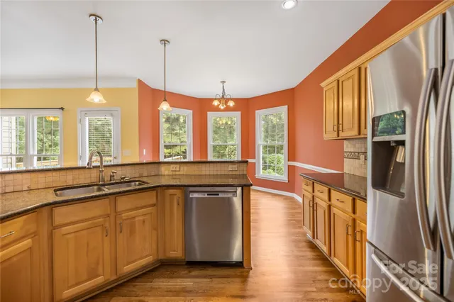 a view of a kitchen with a large window