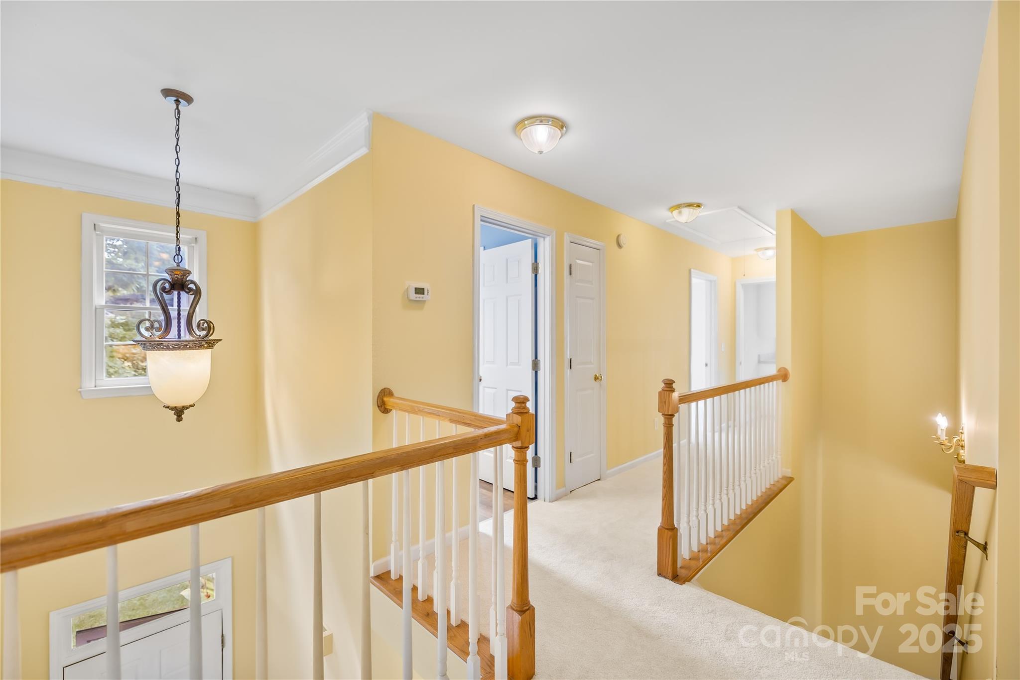 17112 Cambridge Grove Drive Huntersville, NC 28078 - Photo 17 of 44 a view of a hallway with windows